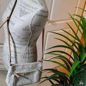 Calvin Kline crossbody bag. White and beige with long adjustable strap. $30
